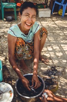 A Myanmar Woman Preparing Squid