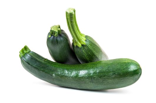 Fresh courgettes on white background
