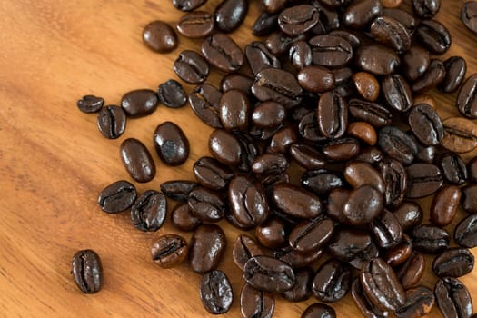Roasted coffee bean on grunge wood table