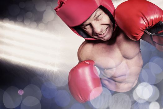 Composite image of high angle view of boxer with headgear and gloves