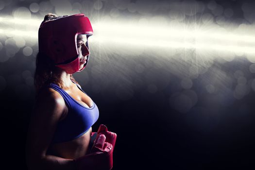 Composite image of side view of female boxer with headgear and gloves