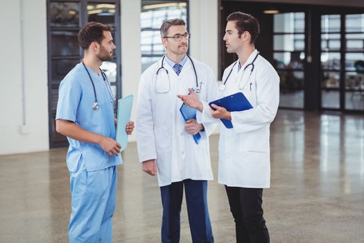 Doctors discussing while standing 