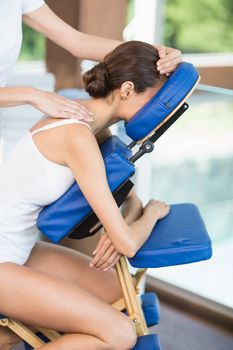 Side view of woman receiving back massage