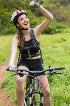 Smiling woman cycling