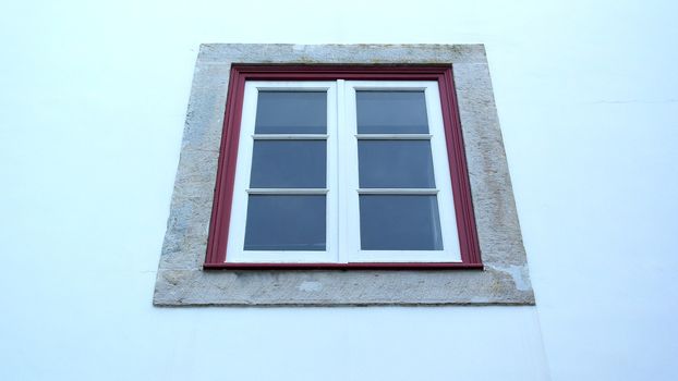 Detail of a red and white window