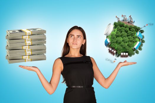 Businesswoman holding cash and earth globe