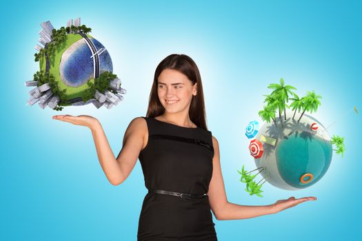 Businesswoman holding two earth globes