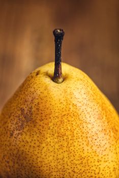 Yellow pear on wooden table