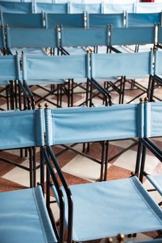 composition of blue canvas folding chairs
