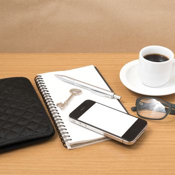 coffee and phone with notepad,key,eyeglasses and wallet