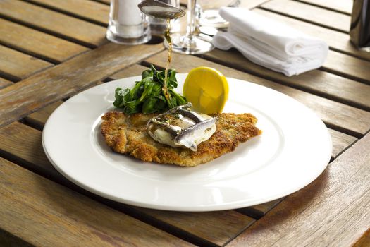 Escalope of veal Holstein with spinach, lemon & anchovies, buerre noisette
