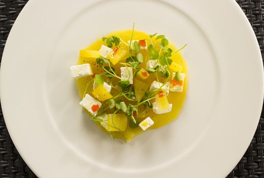 Golden beetroot cappachio with goat’s cheese, baby watercress & smoked paprika oil