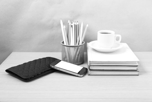 office desk : coffee with phone,stack of book,wallet,color box b
