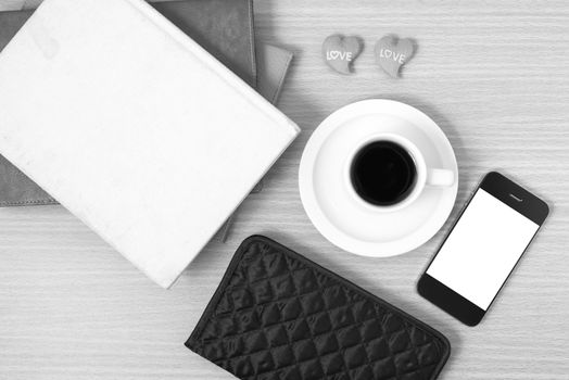 office desk : coffee with phone,heart,stack of book,wallet black