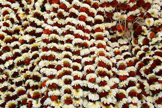 Flowers and garlands for sale at the flower market in the shadow of the Haora Bridge in Kolkata, West Bengal, India