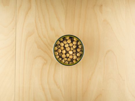 Open tin can with chickpeas, healthy diet