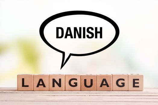 Danish language lesson sign on a table