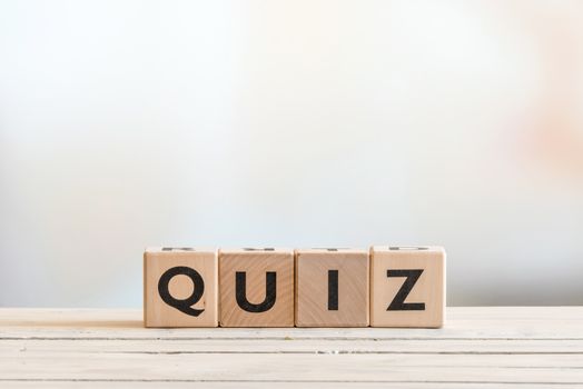 Quiz sign on a wooden table