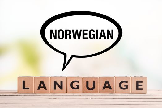 Norwegian language lesson sign on a table