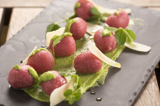 Beetroot & goats cheese gnocchi with pea puree