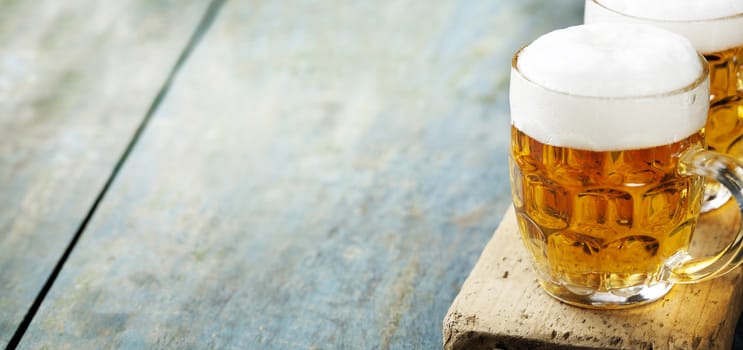  beer on wood background with copyspace