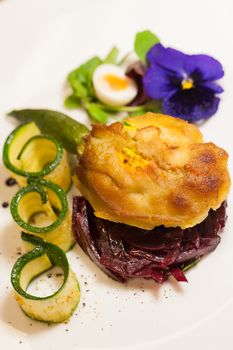 Delicious biscuit with beets, zucchini and pansy