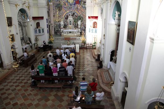 Mass for pilgrims in the Catholic Church Saint Eustache in Dobrota, Montenegro
