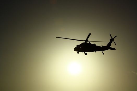Helicopter at sunset with sun view