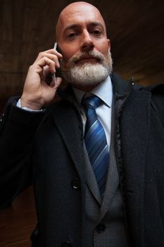 Bearded businessman with working outside the office