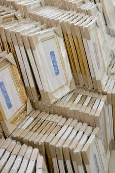 stack of picture frames in printing shop