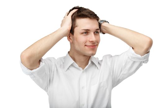 Portrait of a man with his hands on his head isolated on white b