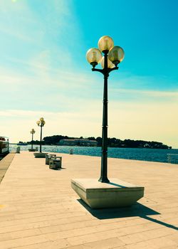 berth with street-lamp on sea background. Pula Croatia