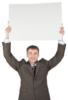 Businessman holding blank paper above his head