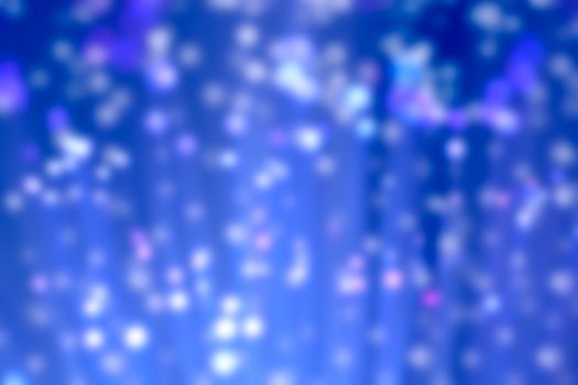 Abstract blur illuminated blue fiber optic light strands, bokeh 