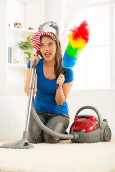 Housewife With Vacuum Cleaner And Duster