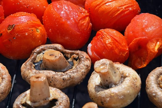 Champignon white mushrooms and tomatoes on grill