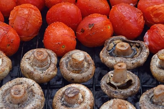 Champignon white mushrooms and tomatoes on grill