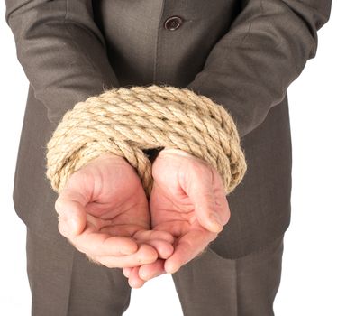 Businessman bound with rope