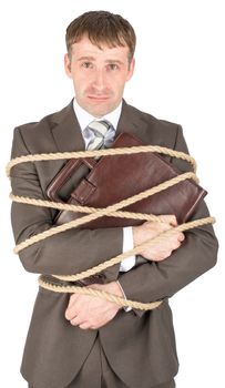 Young businessman tied with ropes