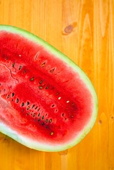 Watermelon cross section slice on wooden table