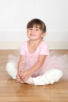 Little ballet girl dancing in the dance studio