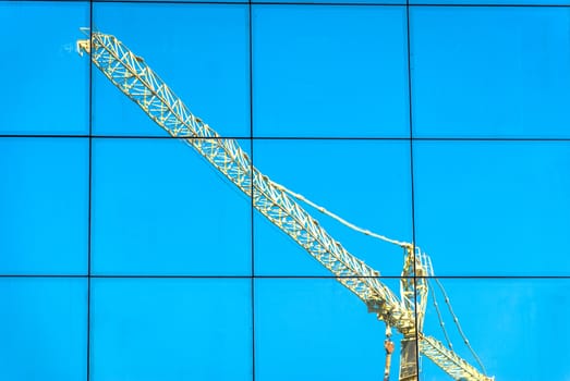 crane reflection over a building v2
