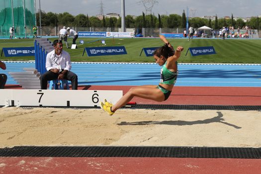 ISTANBUL, TURKEY - SEPTEMBER 19, 2015: Athlete Carmen Ramos long jump during European Champion Clubs Cup Track and Field Juniors Group A