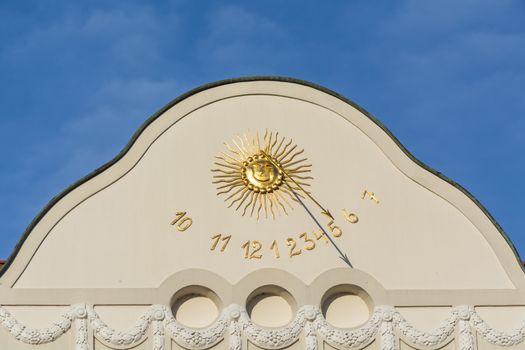  Sundial clock on a house facade