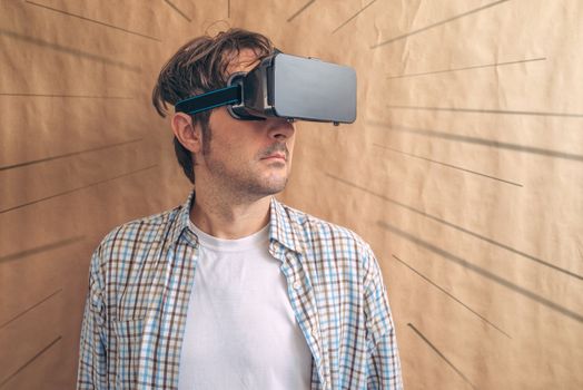 Man with VR goggles exploring virtual reality econtent