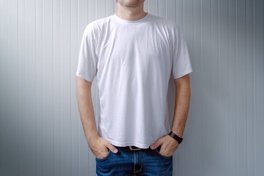 Casual man in jeans trousers and white t-shirt