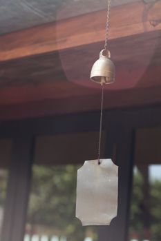 Bell hang on wooden roof