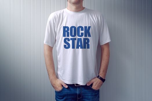 Casual adult male wearing t-shirt with Rock Star title