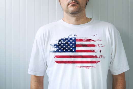 Man wearing white shirt with USA flag print