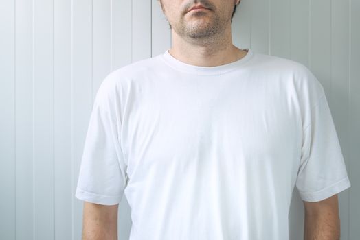 Casual adult male wearing blank white t-shirt